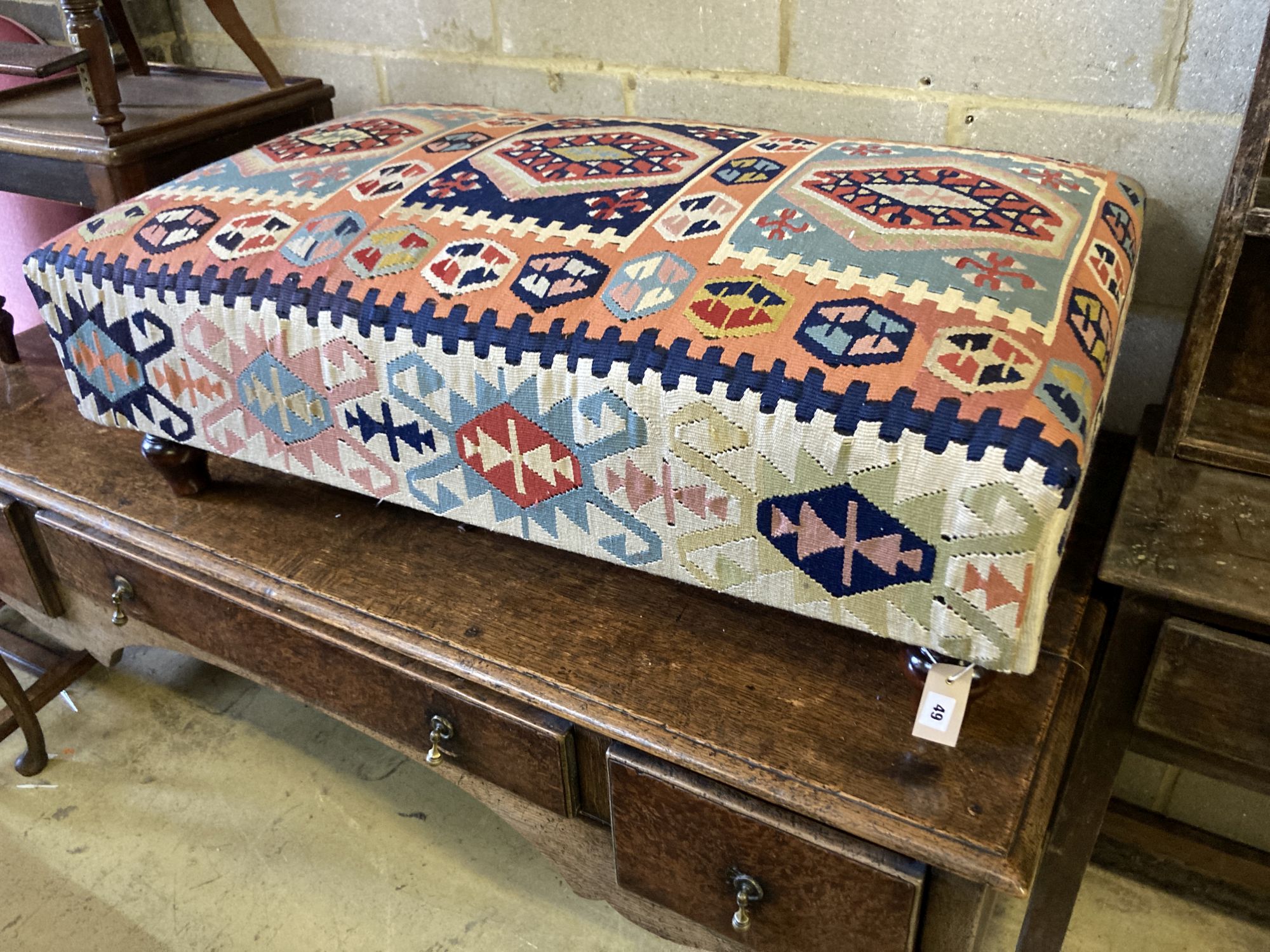 A Victorian style rectangular Kilim upholstered footstool, length 110cm, width 65cm, height 37cm